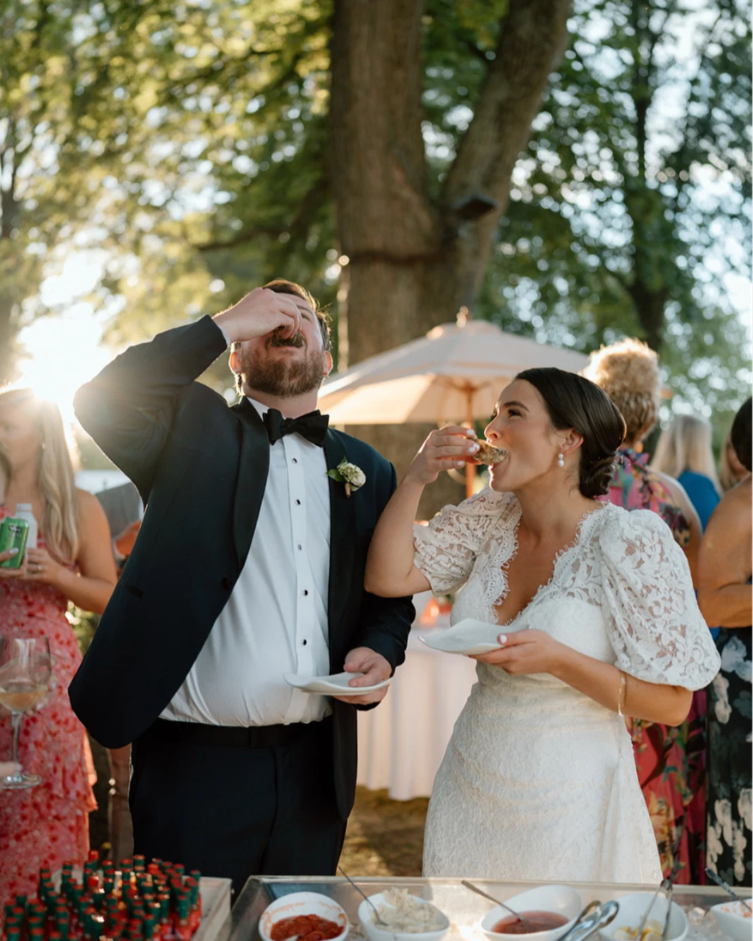 B&G enjoying oysters together at their wedding